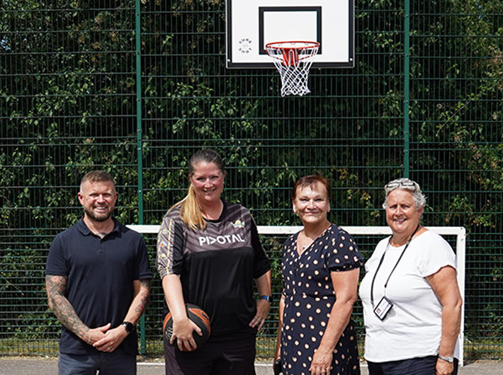 Basketball court in Wymondham with Sue Gilmour, Cllr Carmina McConnell and representatives from Saffron Housing