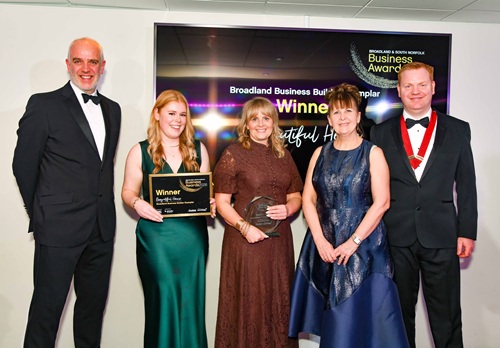 Beeyutiful Home accepting the Broadland Business Builder Exemplar Award 