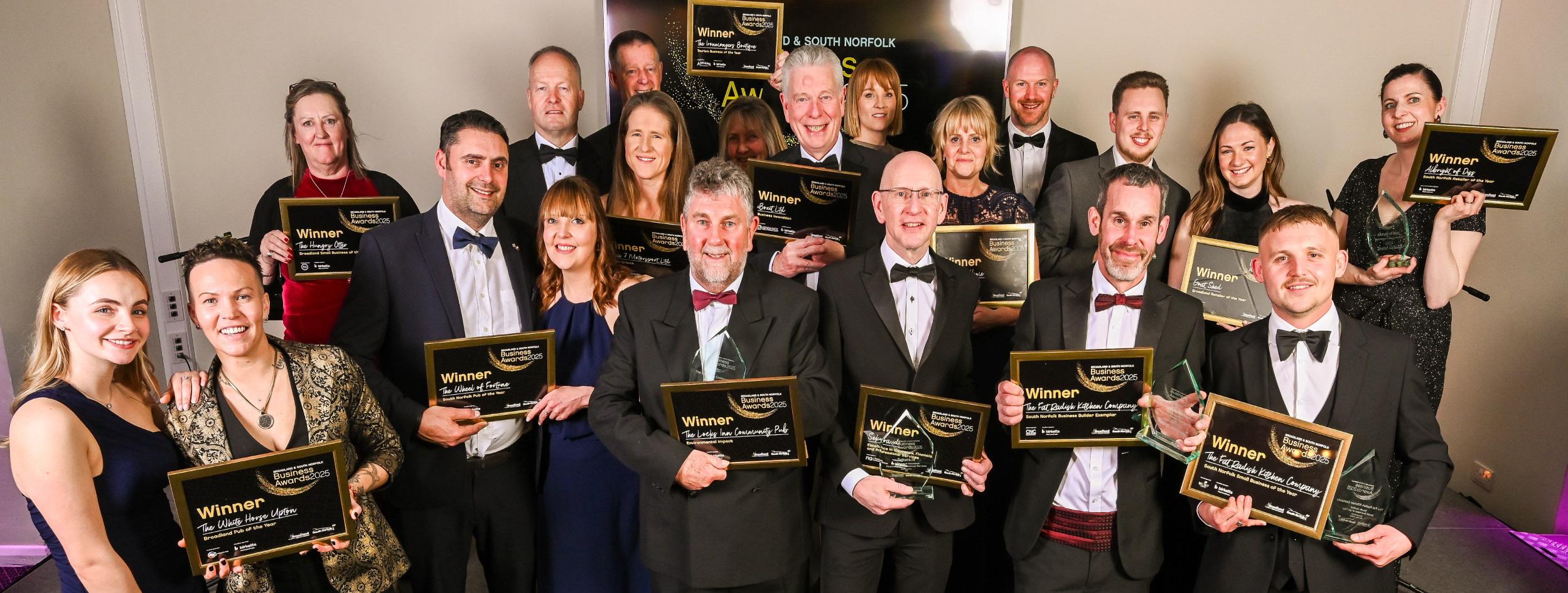 Winners of the 2025 Business Awards holding their certificates and trophies