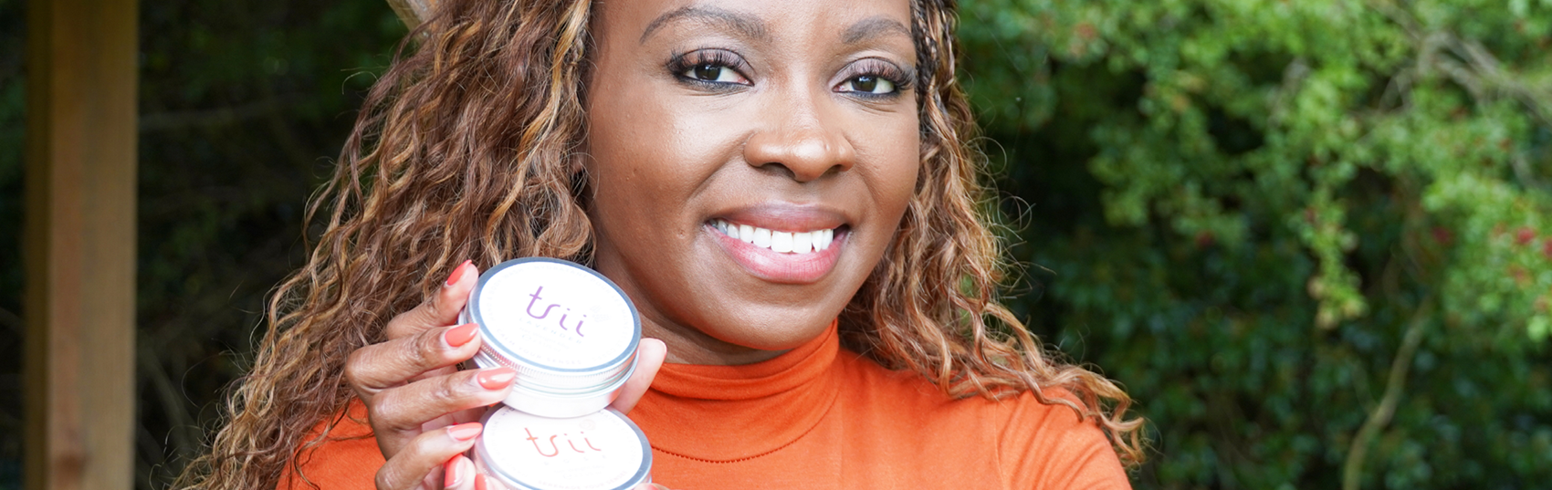 Trii holding award towards camera