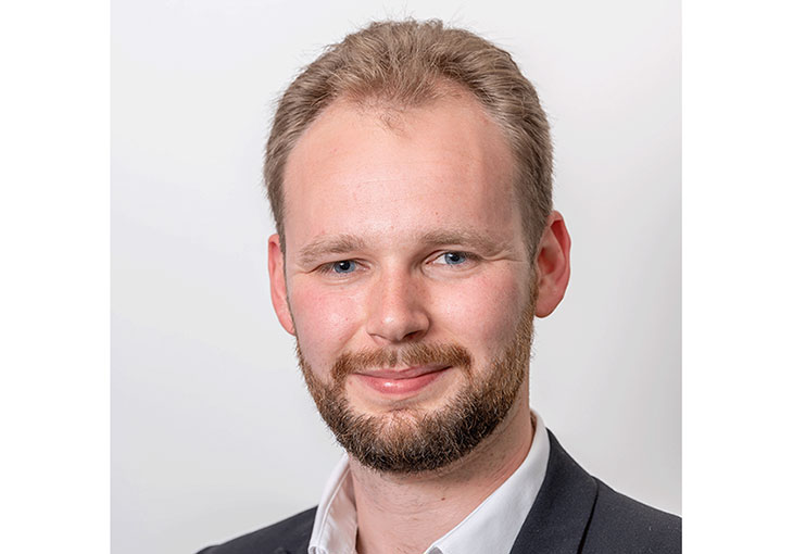 Head shot of man, with short beard and blonde hair