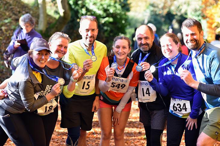 EAMA 10K 2024 runners with their medals