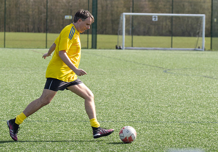 Older man playing football