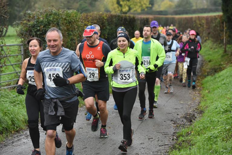 A group of runners of various genders and age ranges