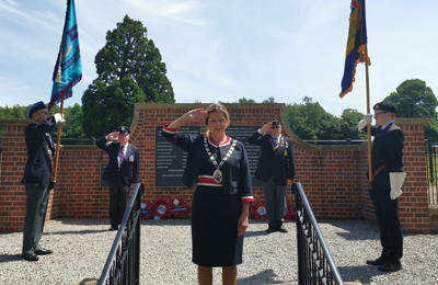 Cllr Karen Vincent, Chairman of Broadland District Council saluting with Armed Forces veterans Mr Alan Harbour, Mr Vic Conley and the Royal British Legion at the war memorial in Old Catton