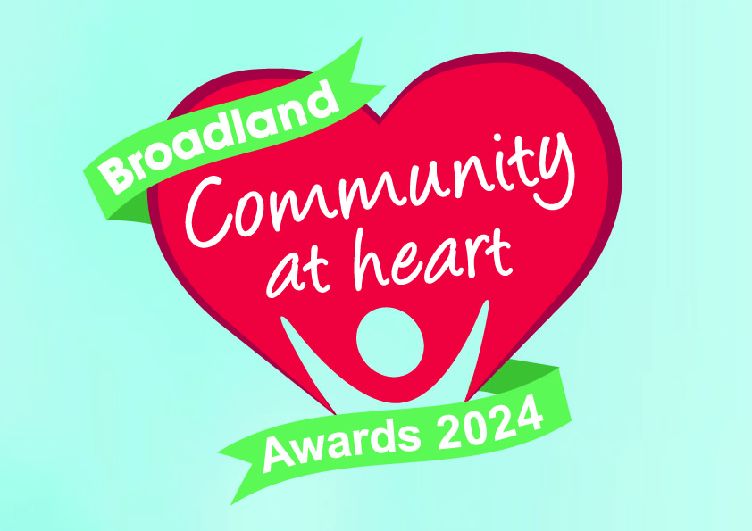 Community at heart logo 24 wirth a cloudy sky background