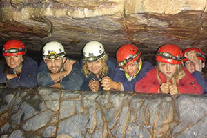 Claire Lincoln and Sprowston Youth Engagement Project in a cave