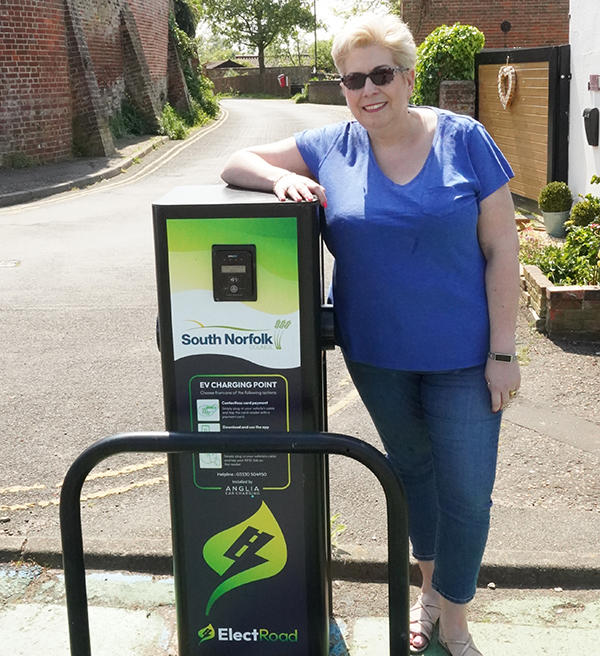 Cllr Lisa Overton-Neal next to an electric charging point