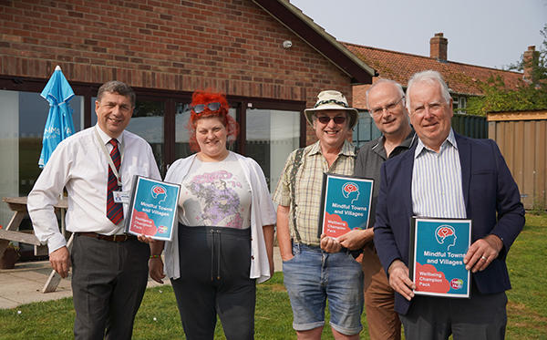 South Norfolk Council’s Deputy Leader, Graham Minshull and local Member, James Easter with the villages’ new certified Wellbeing Champions