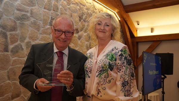 Man presented star trophy by lady