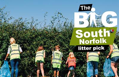 People litter picking in a field