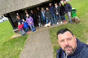 Tim Kett in a park with residents from Thorpe End