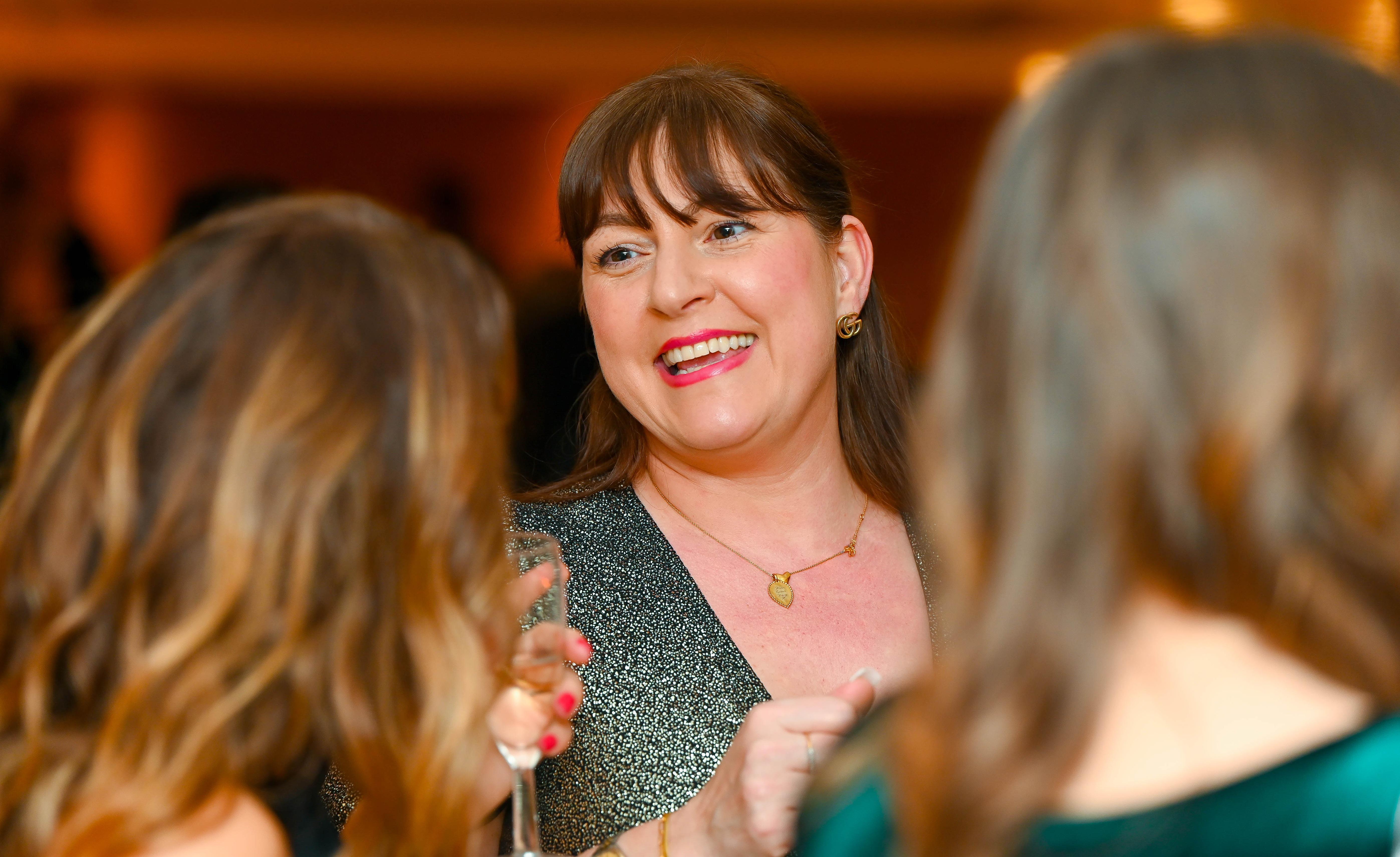 Guest smiling at the 2026 Business Awards