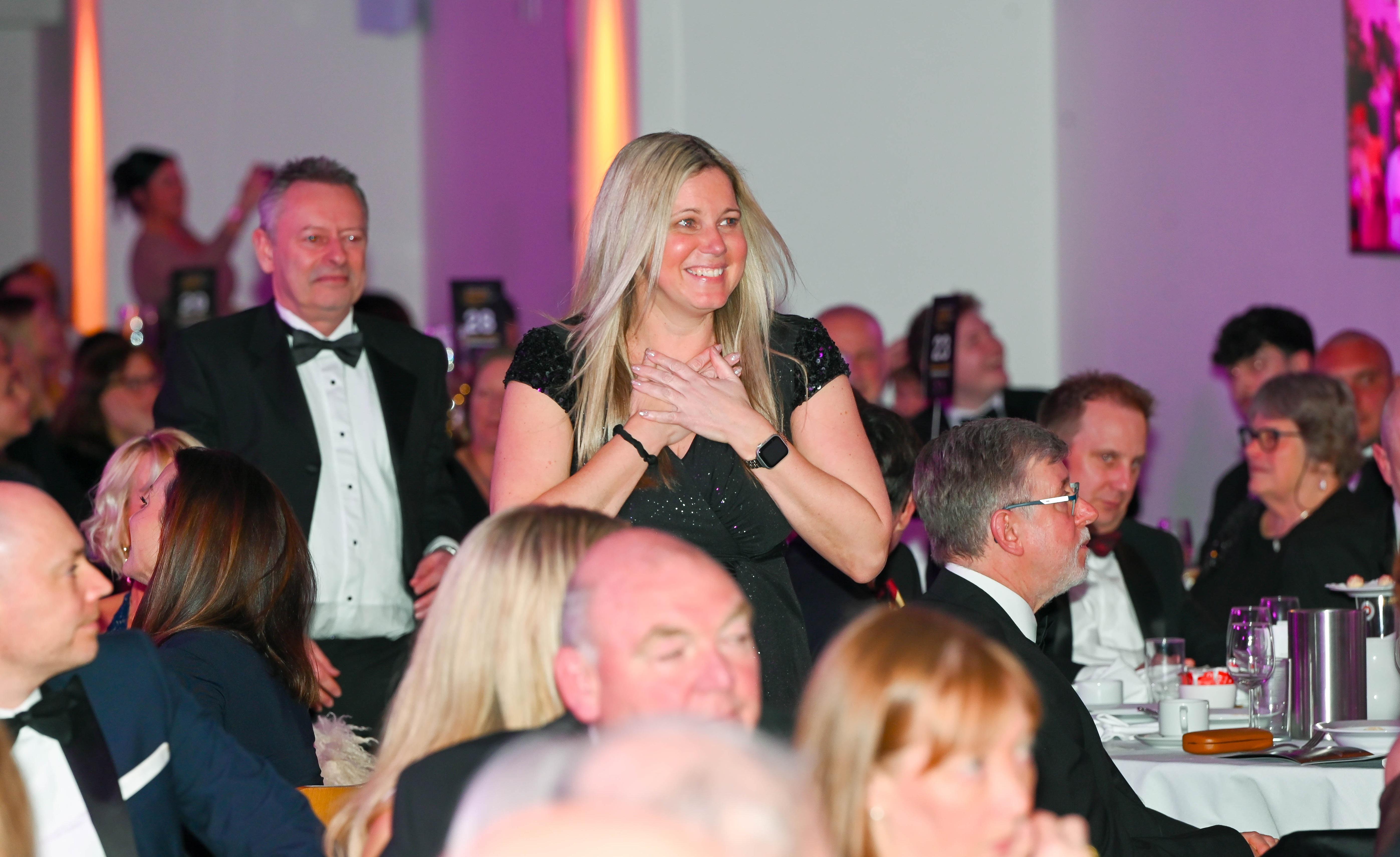 Winner of the 2026 Business Awards going up to the stage