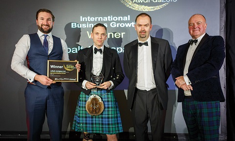 Cobalt aerospace accepting their trophy and certificate for the international business growth award