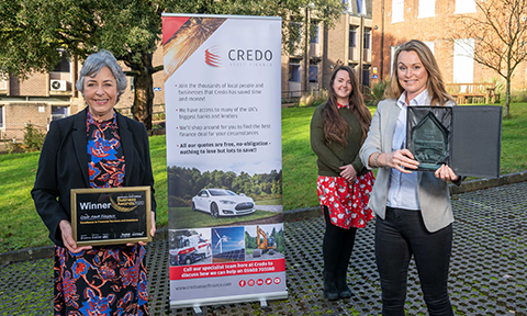 Credo asset finance accepting their trophy and certificate for the excellence in financial services and insurance award