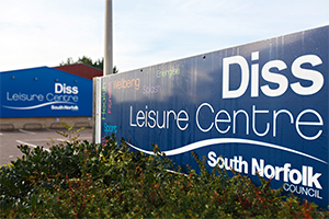 The outside of Diss Leisure Centre with a sign in the foreground