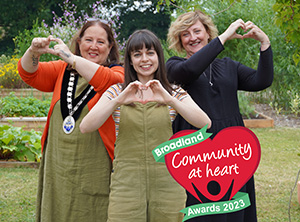 Chairwoman Cllr Karimi-Ghovanlou with previous winner Rebecca Rolfe and Yvonne Ogden from Clarion Housing. All making heart symbols.