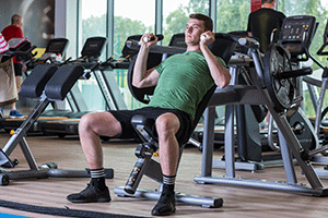man using weights in leisure centre