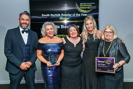 little boutique accepting their 2022 business award certificate and trophy from chairman of south norfolk council cllr florence ellis