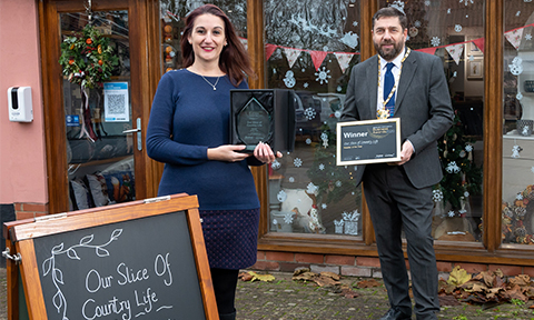 Our slice of country life accepting their trophy and certificate for the retailer of the year award