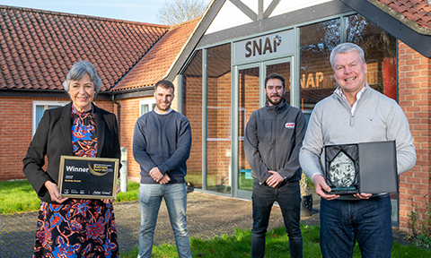 Snap accepting their trophy and certificate for the business growth award