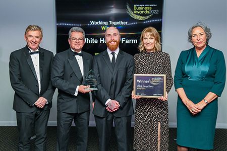 white house farm accepting their 2022 business award trophy and certificate from cllr jo copplestone